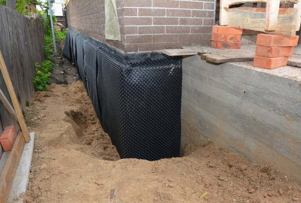 Happy homeowners after waterproofing job in Himrod